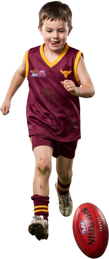 Young Auskicker chasing a footy