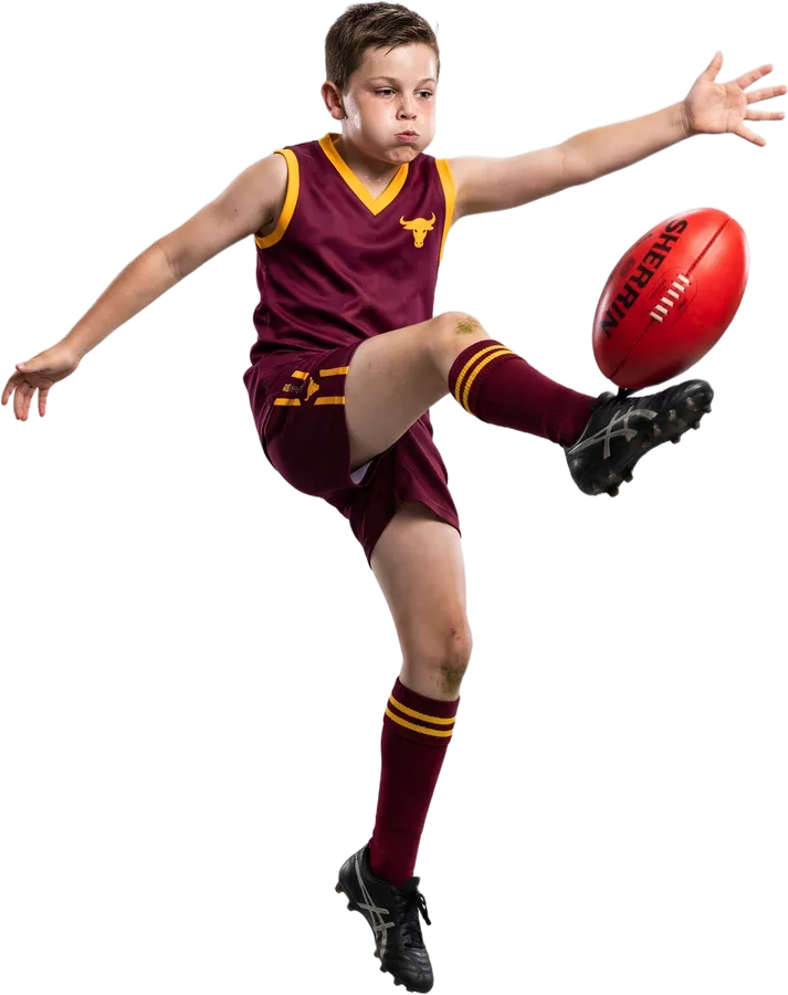 Junior player kicking a drop punt