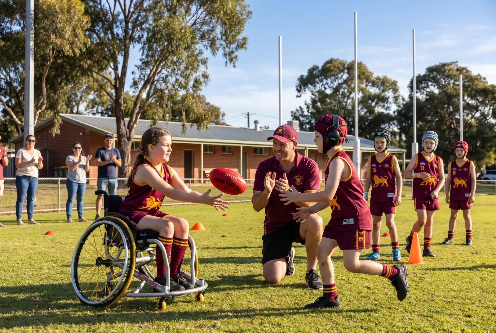 Kids of all abilities playing footy together with their coach